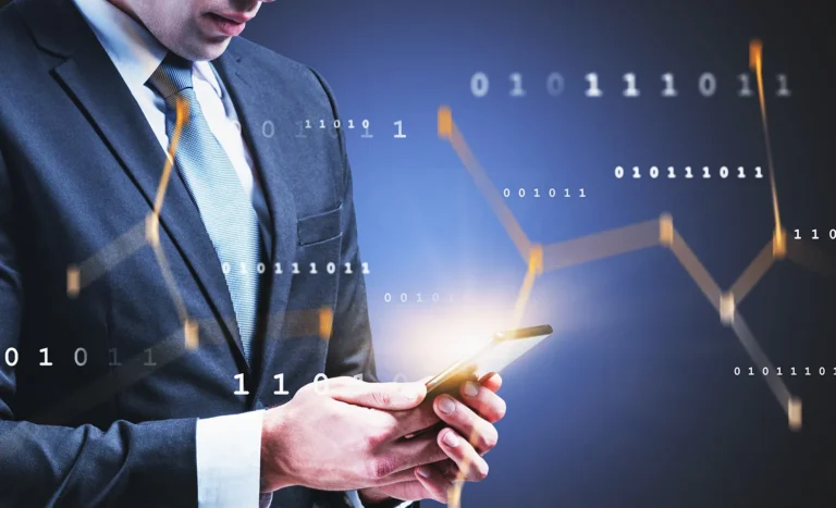 man in a suite holding a cell phone